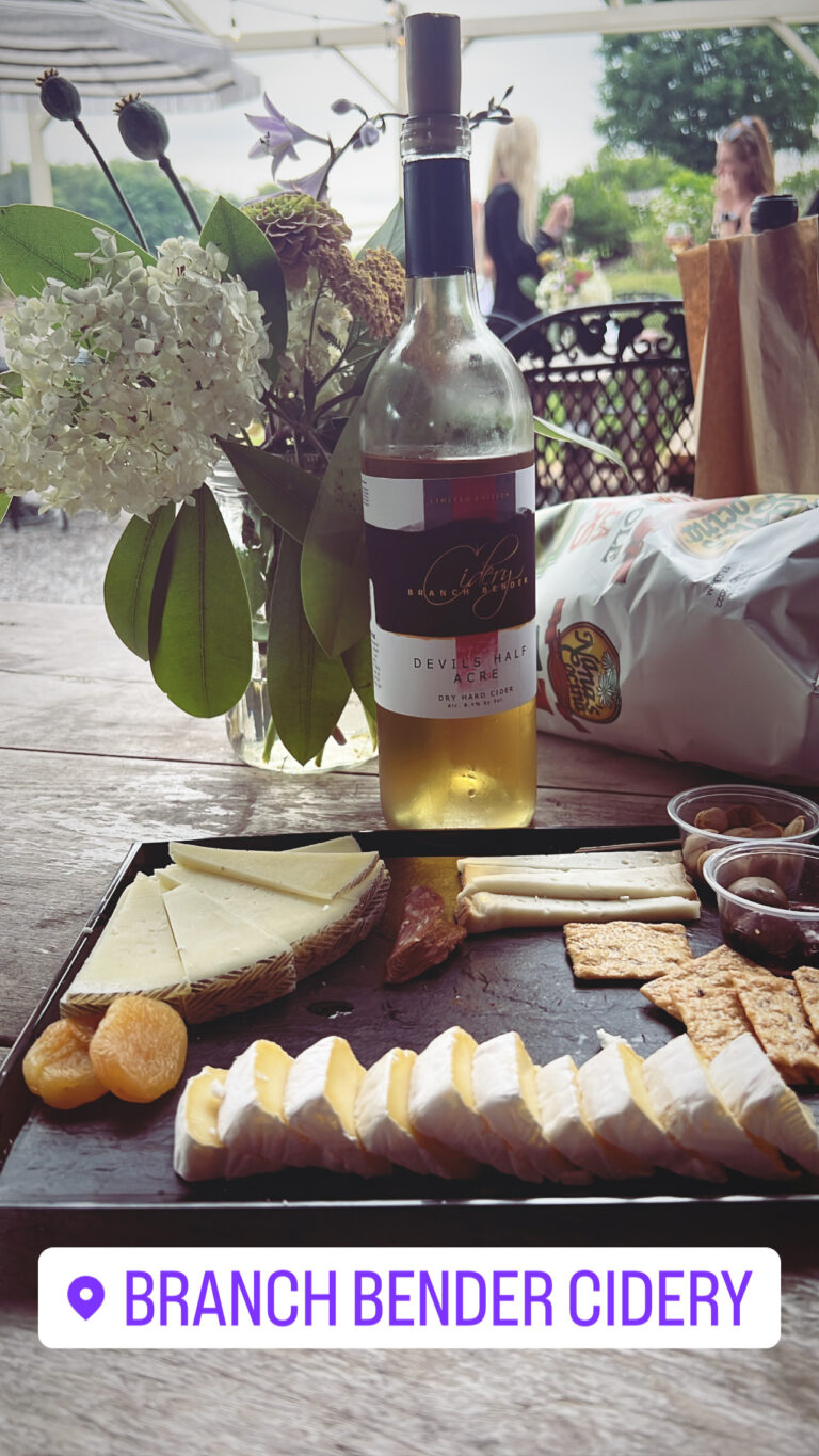 charcuterie tray and branch bender cider bottle