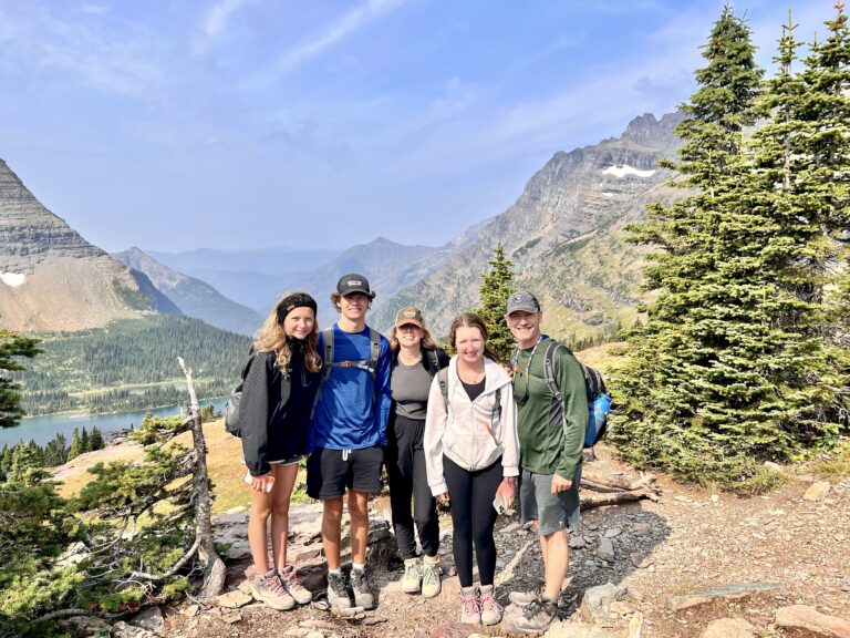 Family posing in front of Hidden Lake