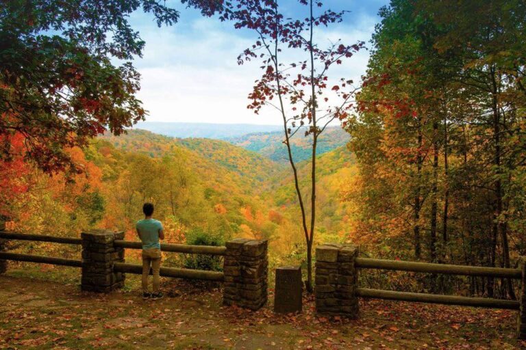 Man overlooking fall scenery deep creek lake