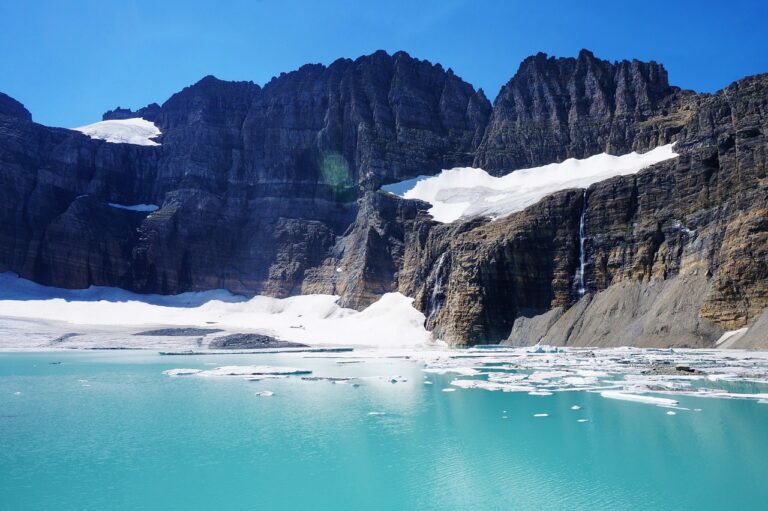 Neon Blue Grinnell Glacier water with snow floating on top