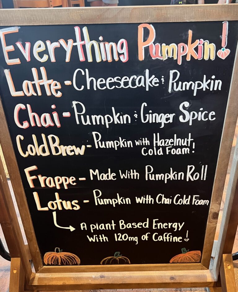 Sign displaying pumpkin and fall flavored drinks at coffee house