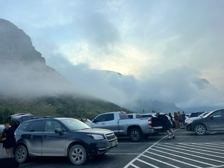 fog low in parking lot of Logan Pass in Glacier National Park