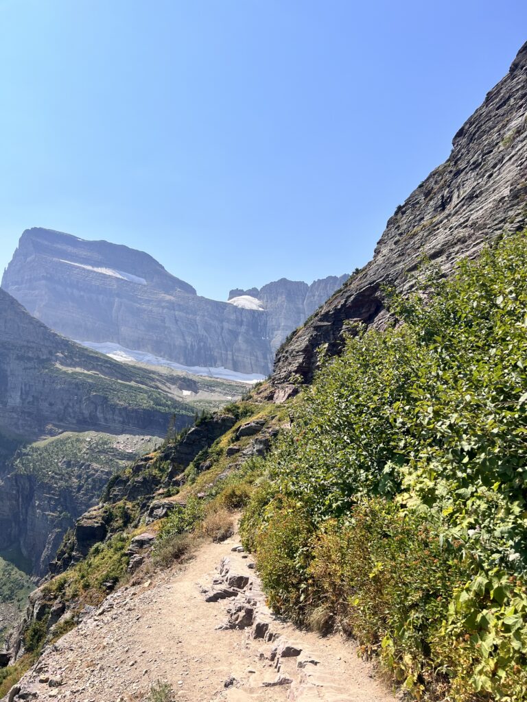 Grinnell Glacier hiking trail with mountains in the distance