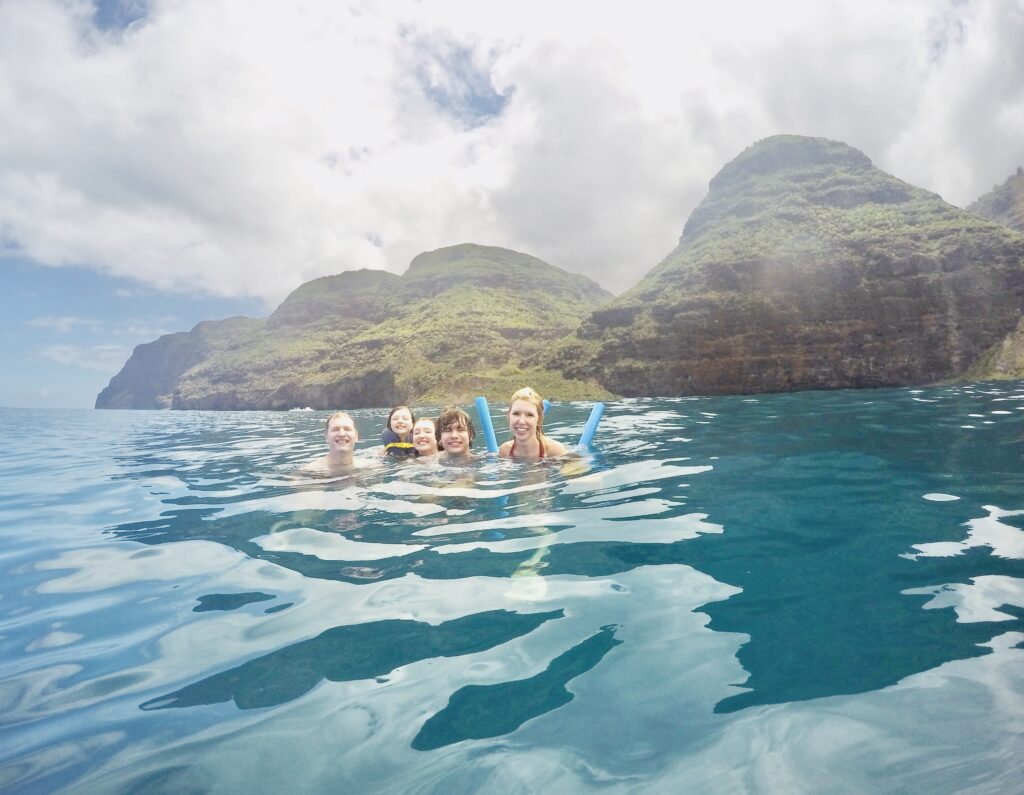 Swimming along the Na Pali Coast in Kauai