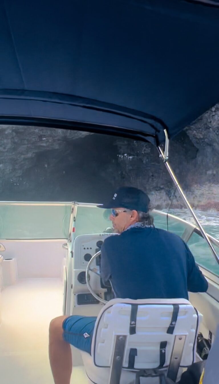 Driving oat into a sea cave along the Na Pali Coast in Kauai