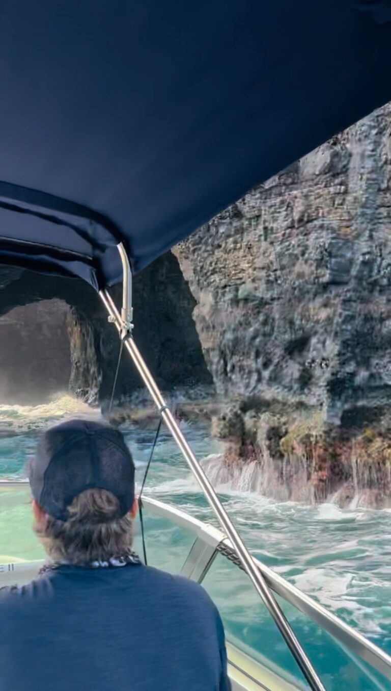 Driving boat into sea cave in the Na Pali Coast, Kauai