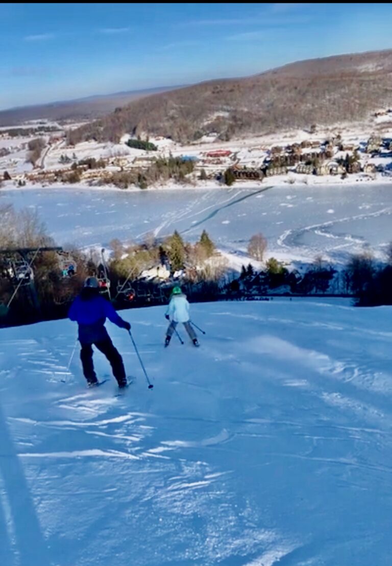 Skiing down slope in winter in Deep Creek Lake