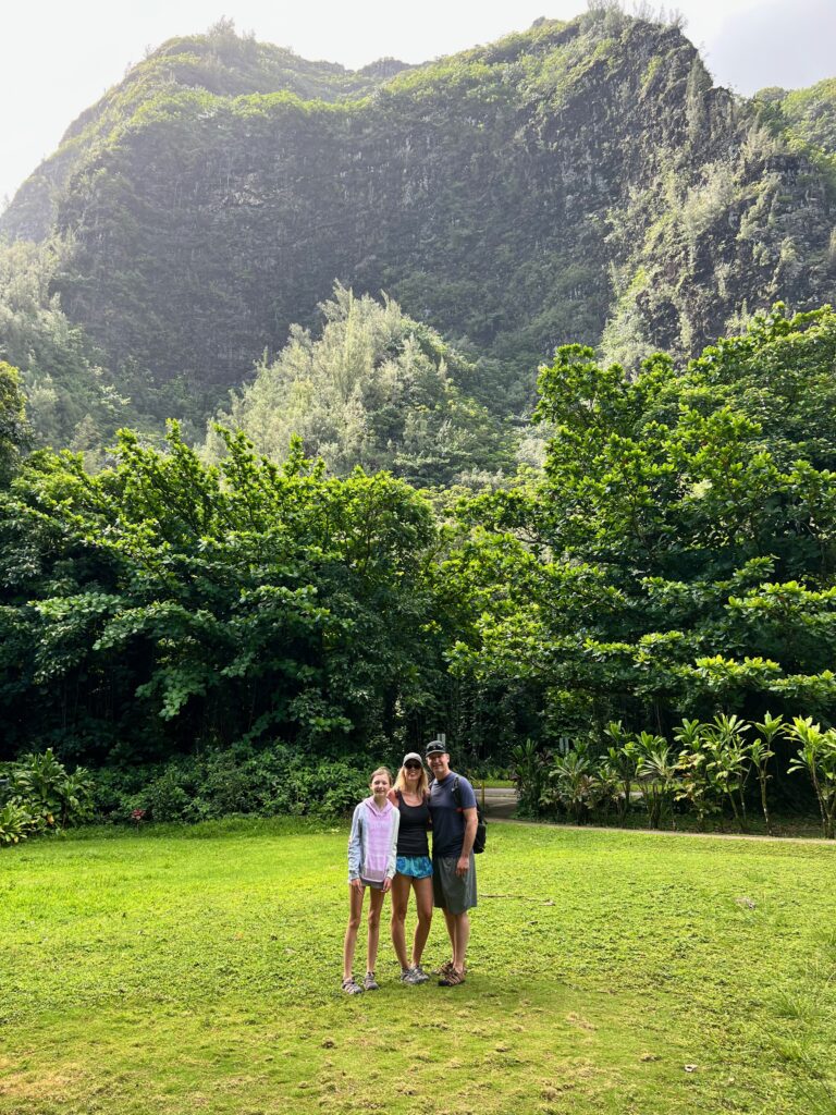 Mountains and clearing by the restroom building at the Kalalau Trailhead