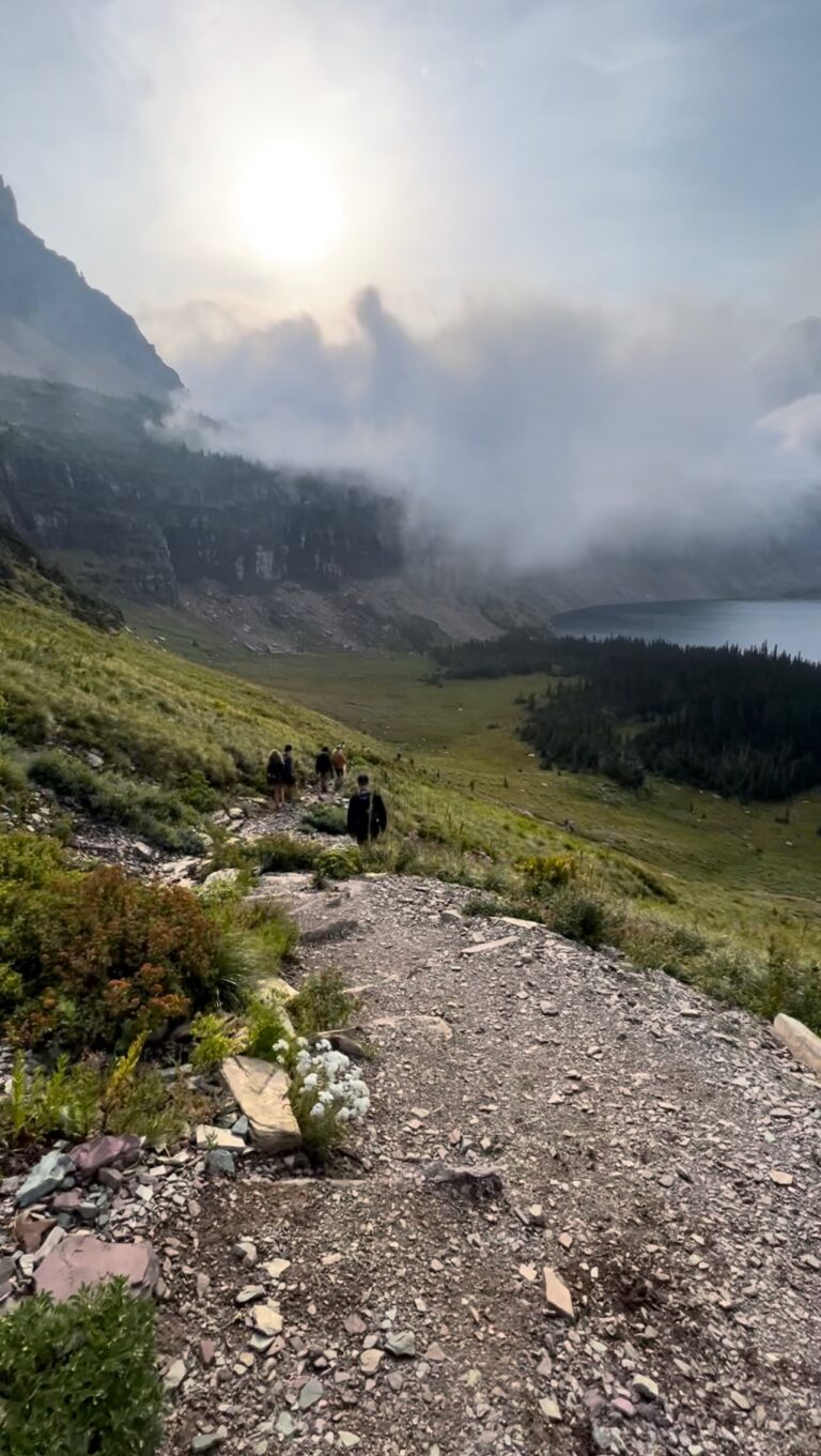 Hikers walking down to Hidden Lake in Glacier National Park